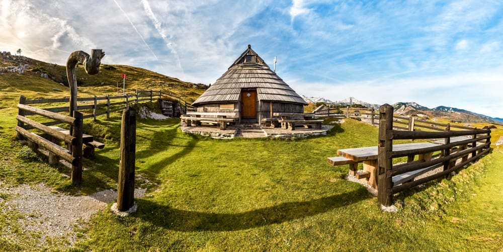 Mountain cottage hut or house on idyllic hill Velika Planina. Bio Eco farming healthy life