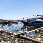 Rubbish in the water at Da Nang's fishing port