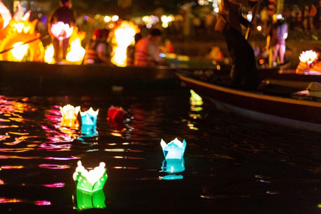 Paper lanterns float in the river