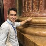 Andrzej proving the columns are hollow in the Jesuit Church
