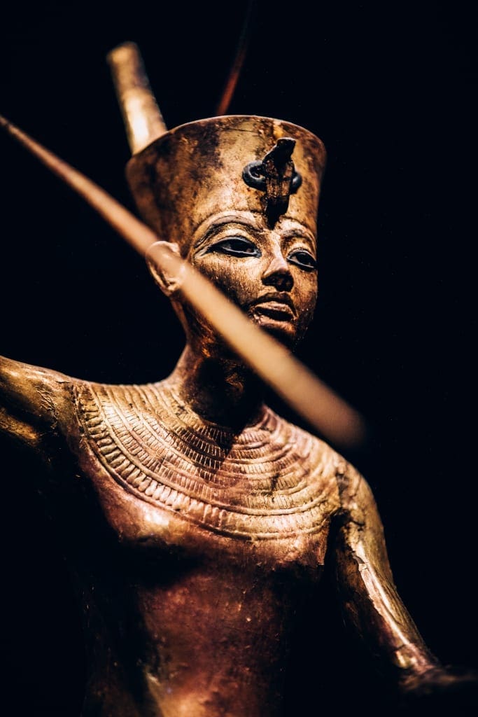 Gilded Wooden Figure of Tutankhamun on a Skiff, Throwing Harpoon - CREDIT IMG