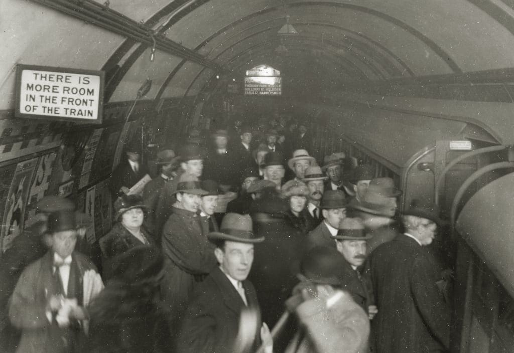 A crowded Tube platform in the rush hour at Piccadilly Circus, 1922