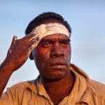 Portrait, Aboriginal man applying welcome clay.