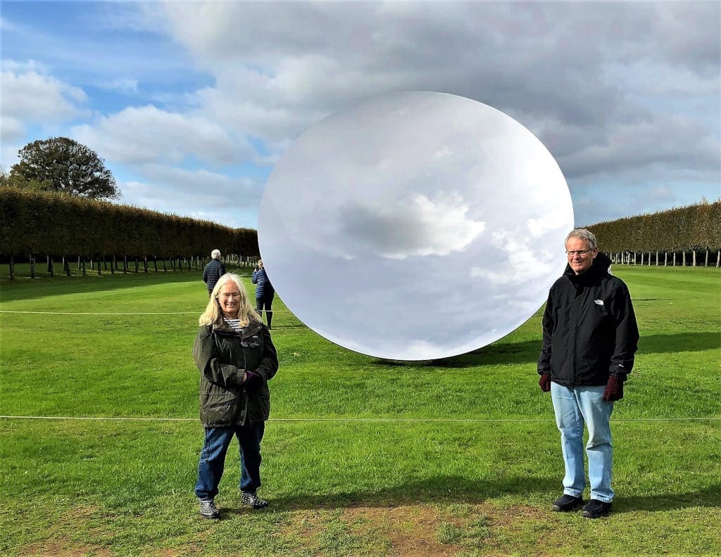 Roger and Eileen beside Anish Kapoor's Sky Mirror at Houghton Hall