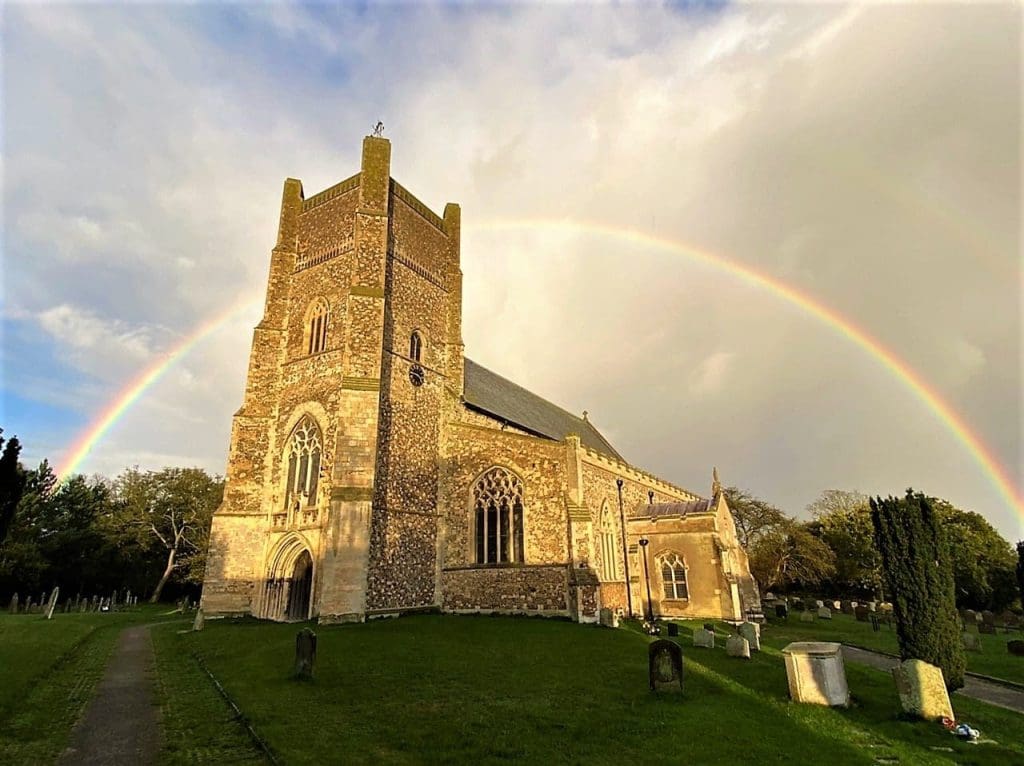 A rainbow hovering above St Bartholomew's Orford