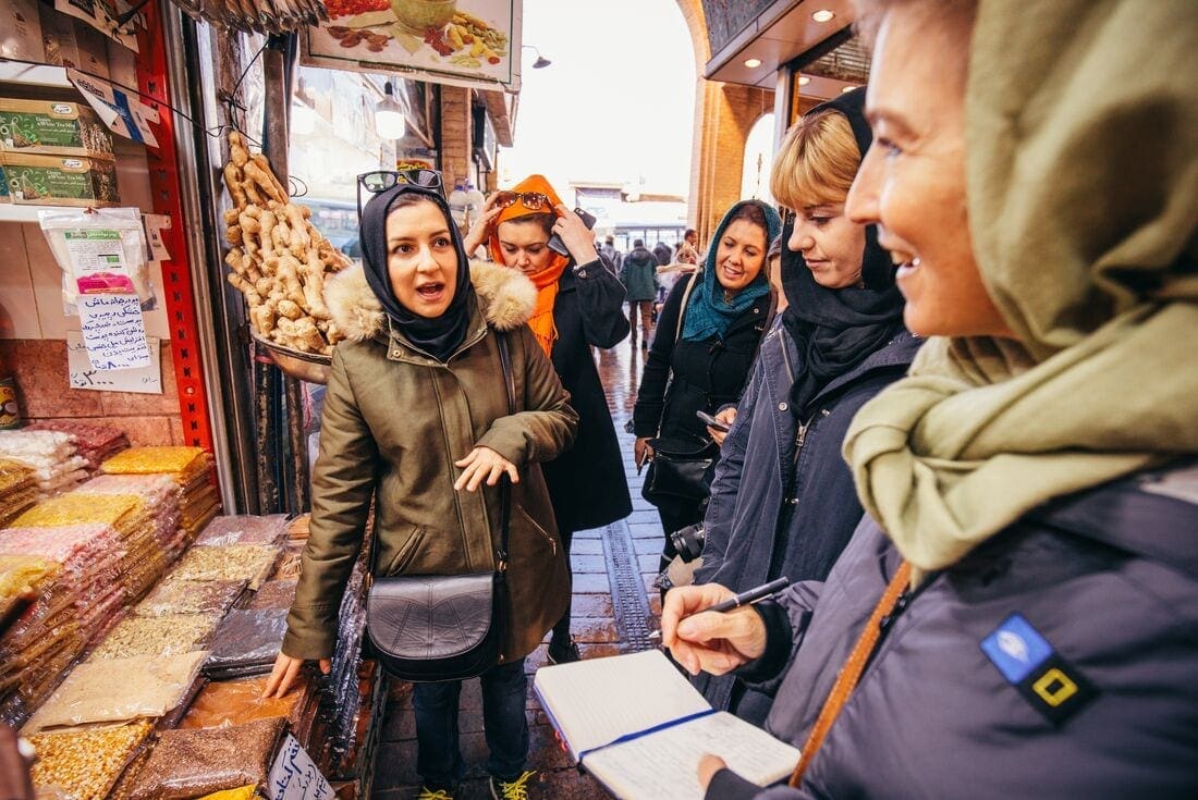 Intrepid Travel customers visit a market in Tehran, Iran