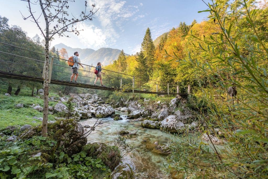 Hiker on the Alpe Adria route, Trenta Slovenia