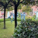 Statues of women dancing naked in the gardens of the Cells Almshouses
