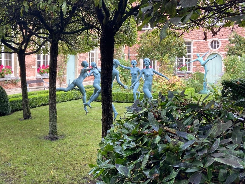 Statues of women dancing naked in the gardens of the Cells Almshouses