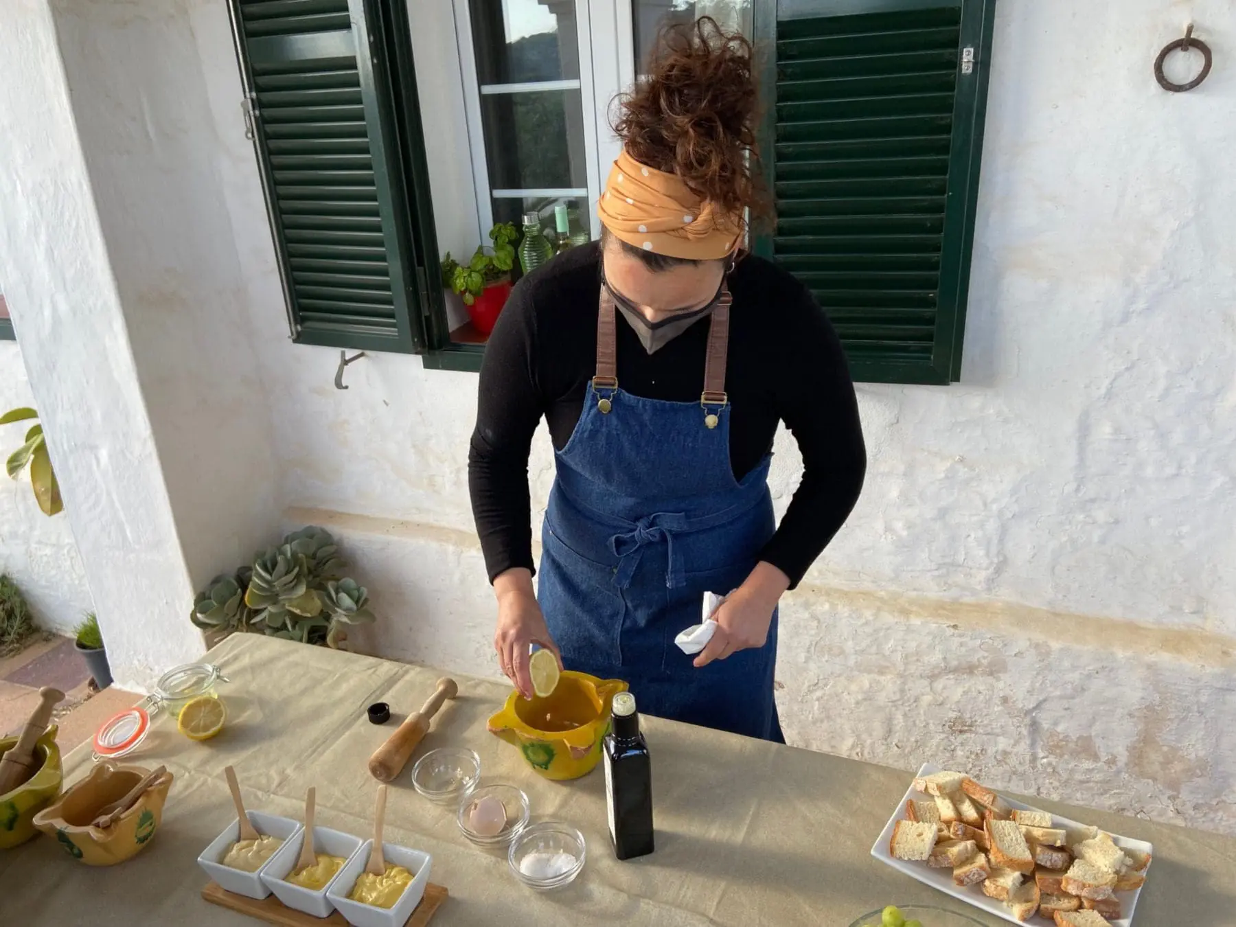 Being shown how to make Mayonaise on Menorca holidays