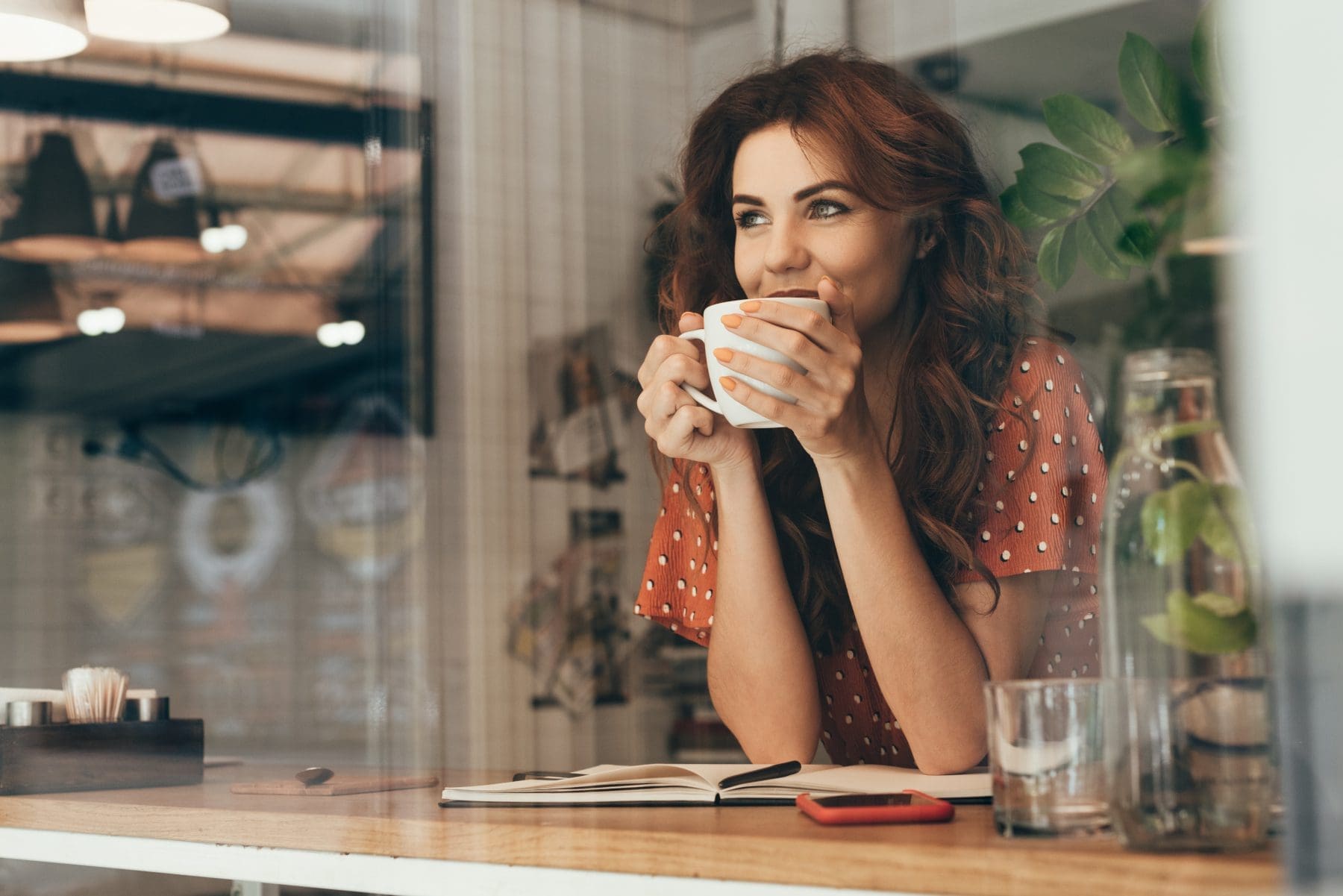 travel blogger drinking coffee