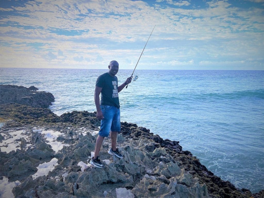 Shawn trying to catch fish as Barbados tourism recovers