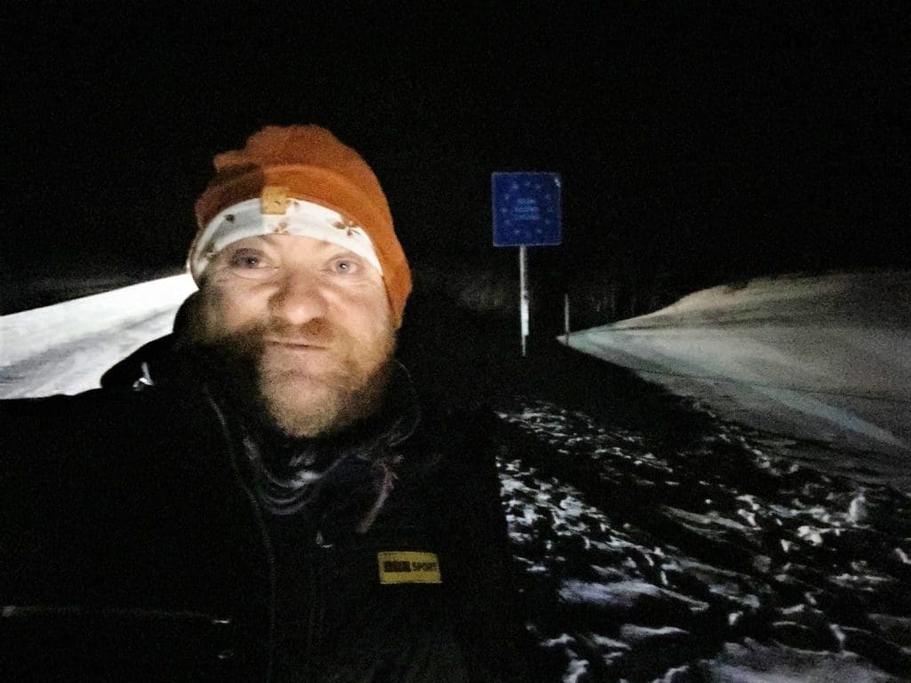 Mark at the Finnish border during Northern Lights experience.