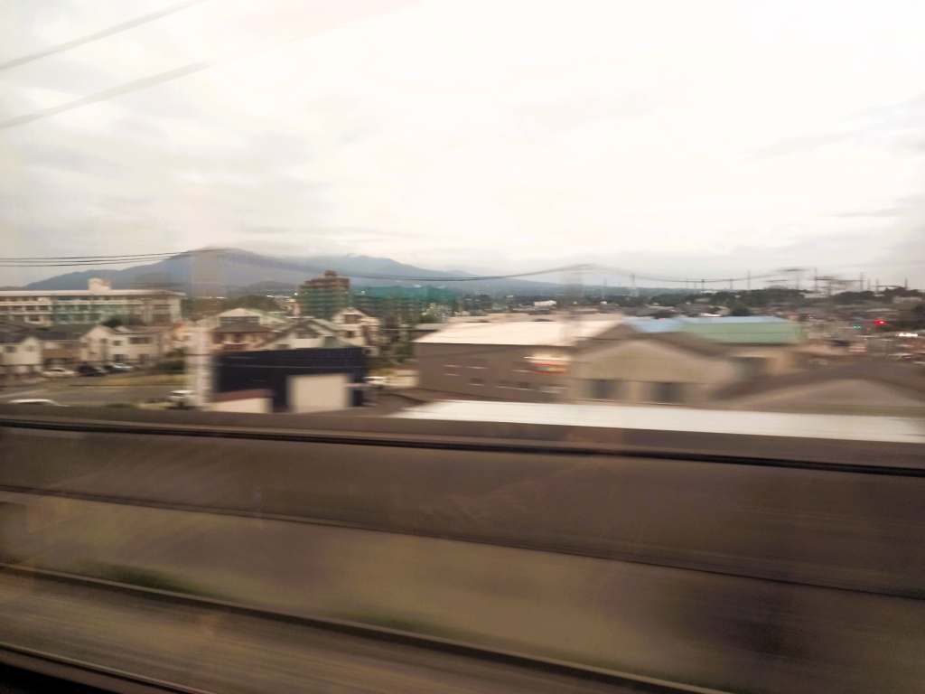 Blurred view of Mount Fuji from the window of the Bullet Train