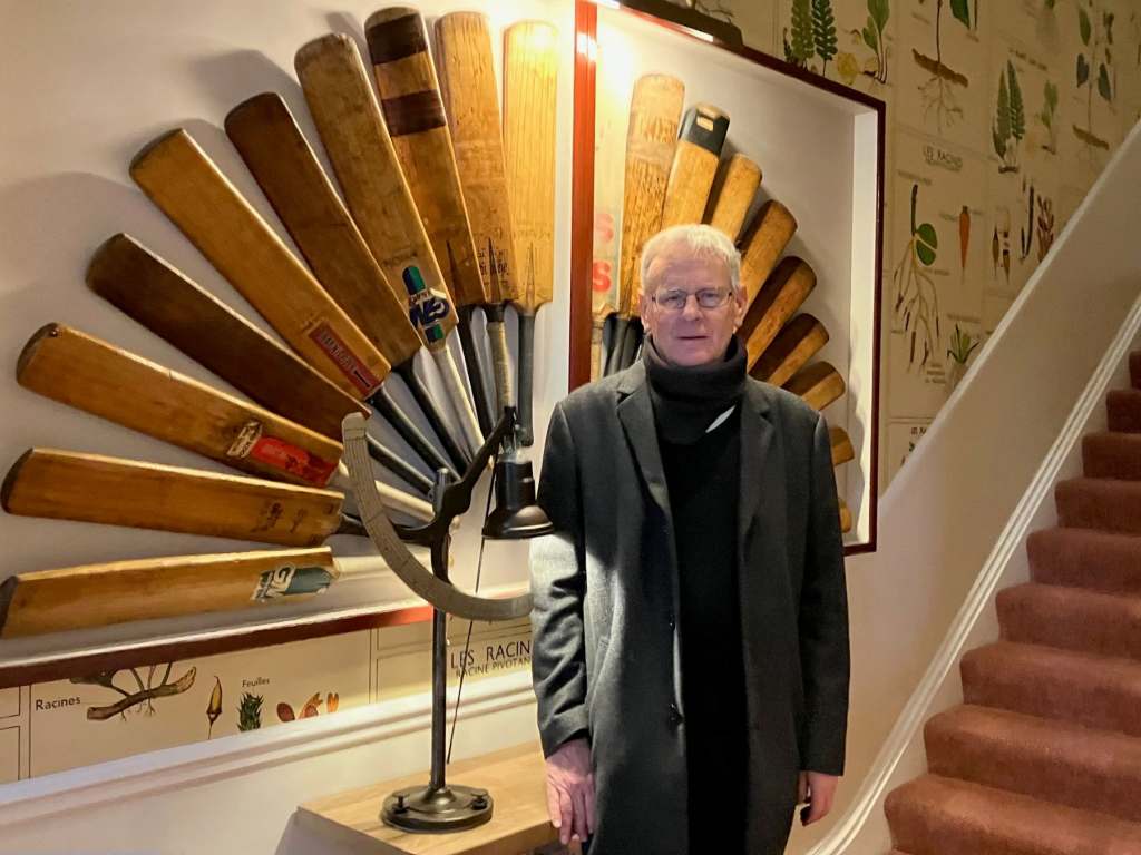 Roger with his fan of cricket bats