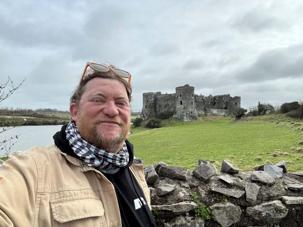 Bibby with Carew Castle in the background