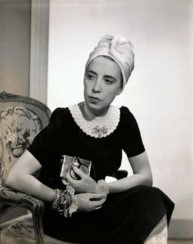 Vogue 1940; Designer Elsa Schiaparelli wearing black silk dress, crocheted collar, turban of her own design (Photo Fredrich Baker, Condé Nast via Getty Images)