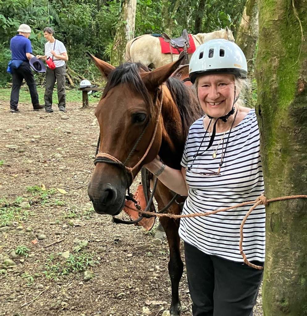 Eileen with horse after ride at Selva Bananito Lodge