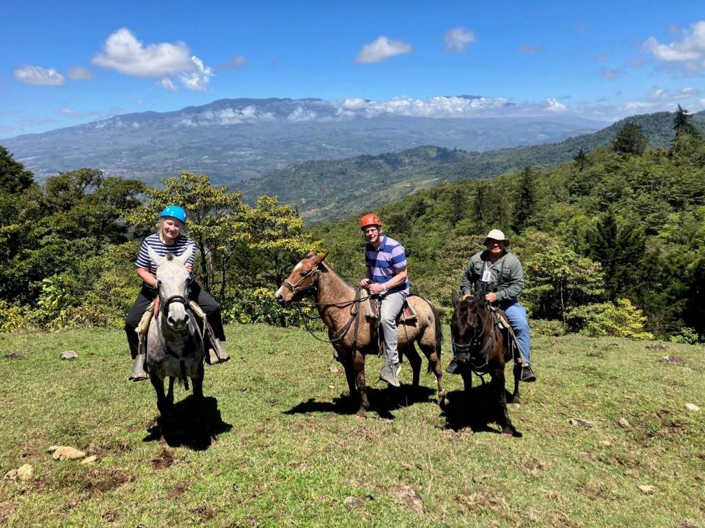 Roger, Eileen and Roberto (their guide) on horse ride in the Orosi Valley