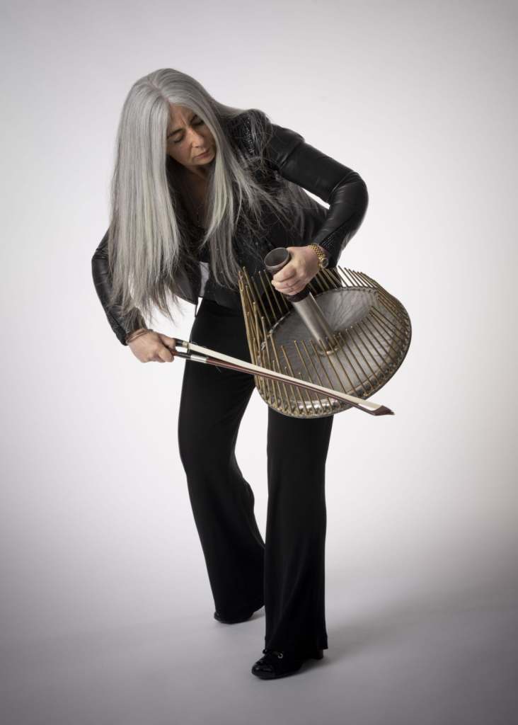 Dame Evelyn Glennie performing on her 'Waterphone', ©Stephen Iliffe, Deaf Mosaic