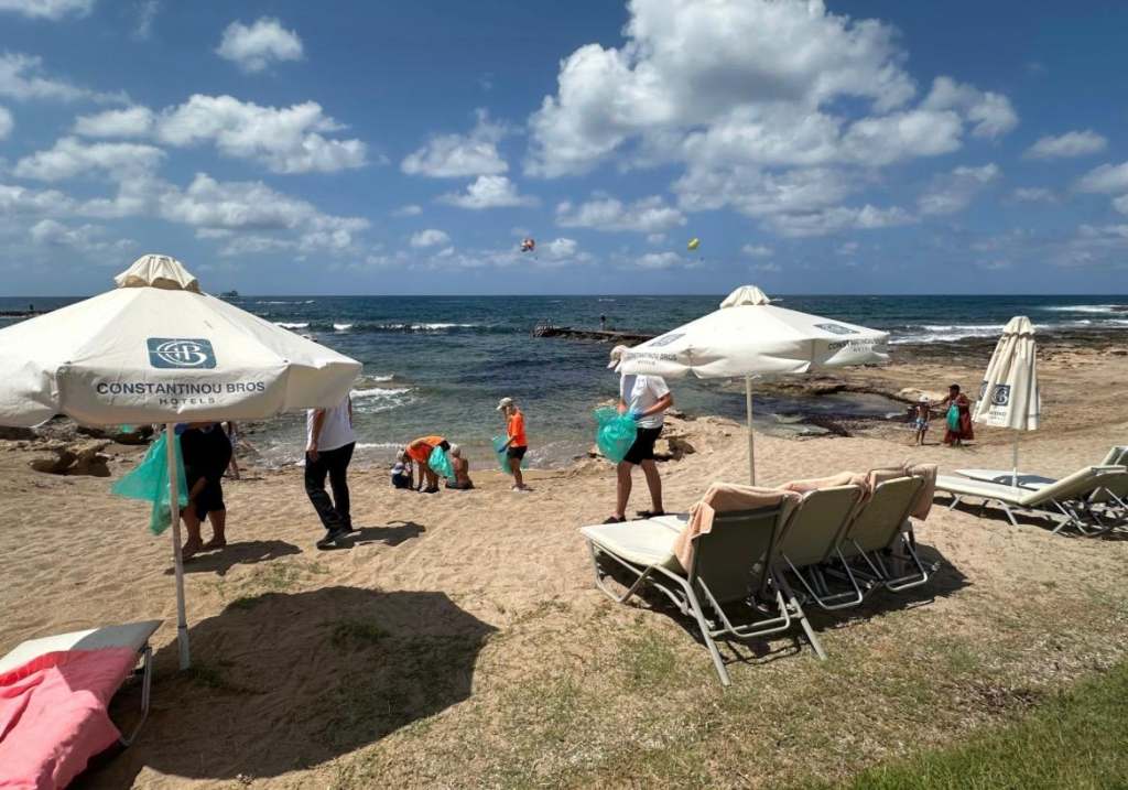 Beach cleaning is part of the sustainability initiatives at Sunset from my suite at Constantinou Bros Asimina Suites