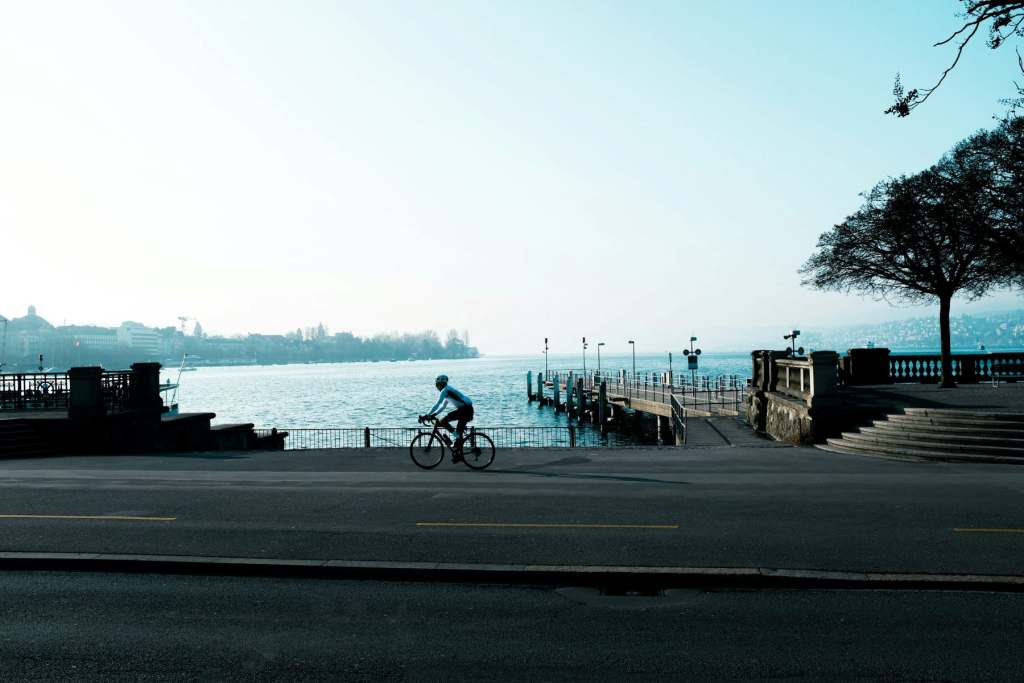A cyclist passing the lakefront at BC<rkliplatz in Zurich.